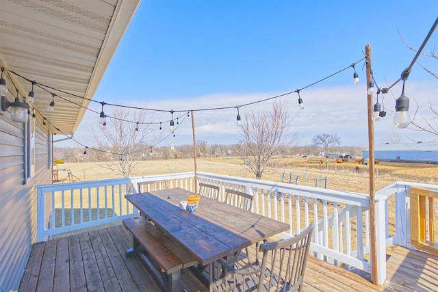 wooden terrace featuring outdoor dining space