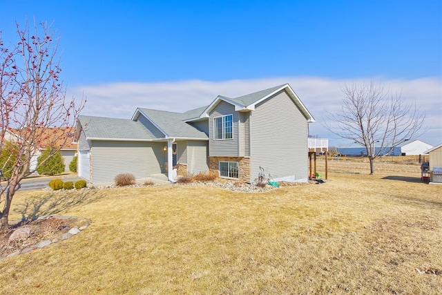 view of side of home featuring a yard