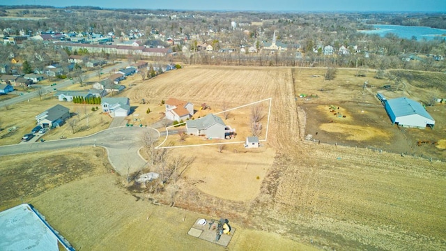 birds eye view of property with a residential view