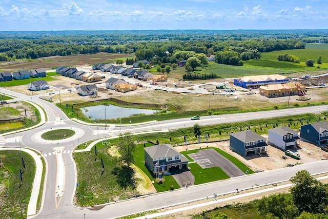 drone / aerial view featuring a residential view and a water view