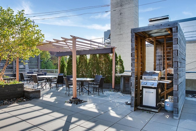 view of patio / terrace featuring grilling area, outdoor dining space, and a pergola