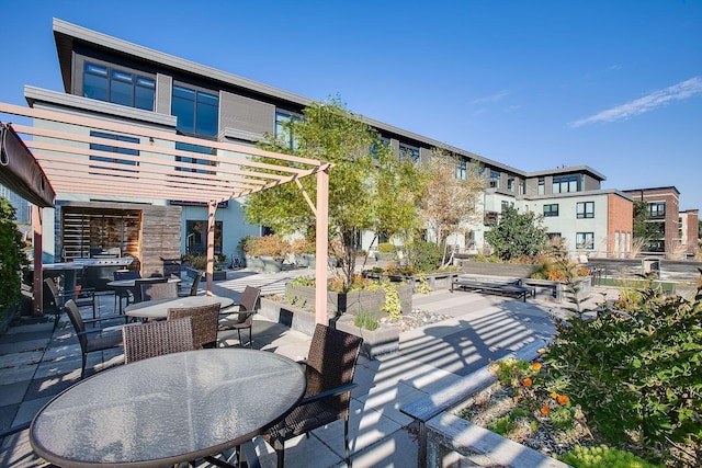 view of patio / terrace featuring a pergola and outdoor dining area