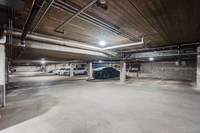 parking garage featuring concrete block wall