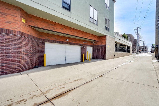 garage with concrete driveway