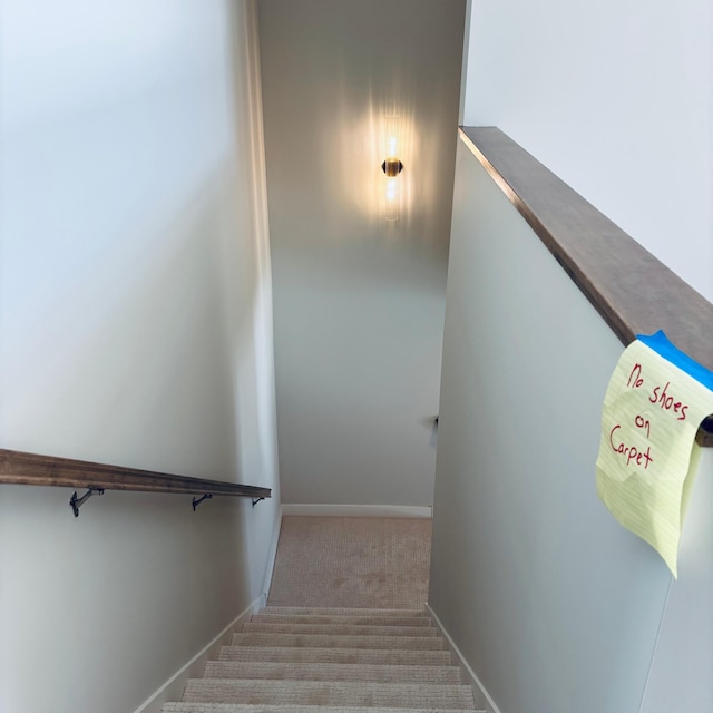 stairway with carpet flooring and baseboards