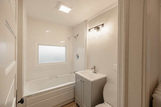 bathroom with  shower combination, vanity, and toilet