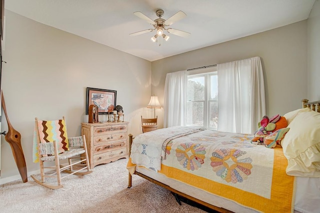 bedroom with a ceiling fan and carpet flooring