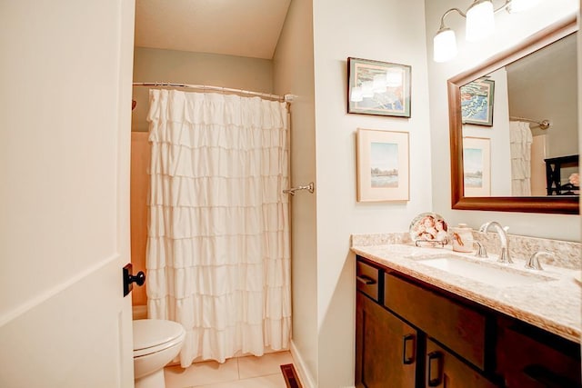 full bathroom featuring a shower with shower curtain, vanity, toilet, and tile patterned floors