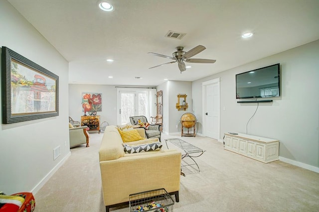 living room featuring baseboards, light colored carpet, visible vents, and recessed lighting