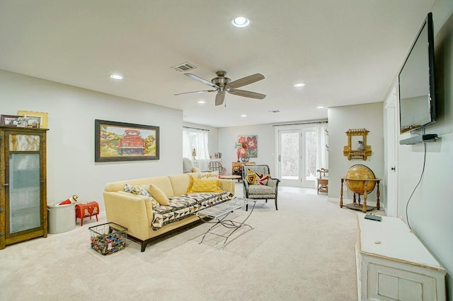 carpeted living area featuring ceiling fan, baseboards, visible vents, and recessed lighting