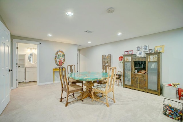 dining space with recessed lighting, light carpet, visible vents, and baseboards