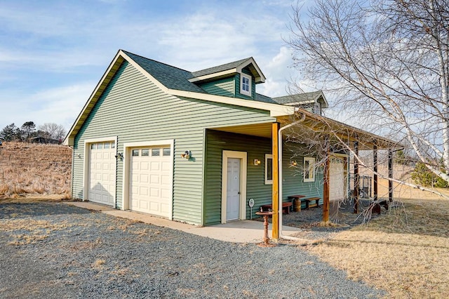 exterior space with a shingled roof