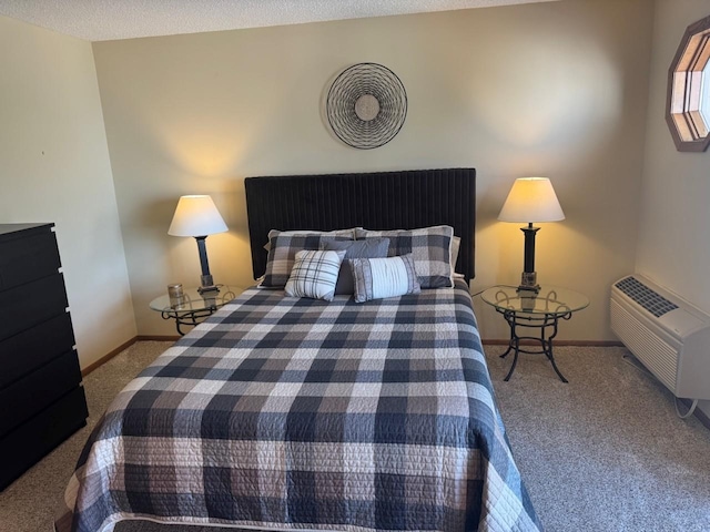 bedroom featuring carpet flooring, baseboards, and a wall mounted AC