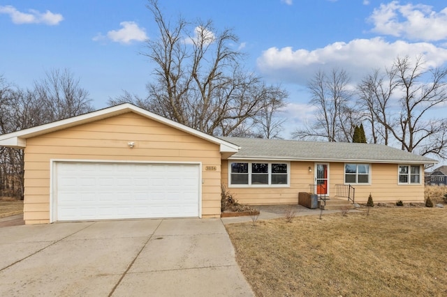 single story home featuring concrete driveway, roof with shingles, and an attached garage