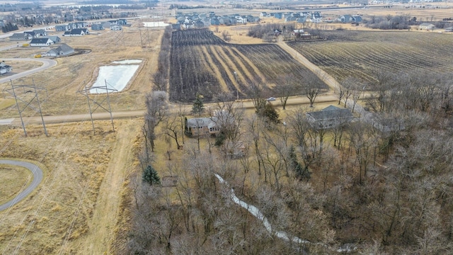 birds eye view of property with a rural view