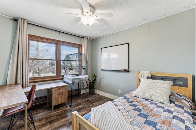 bedroom with dark wood-type flooring, ceiling fan, a textured ceiling, and baseboards