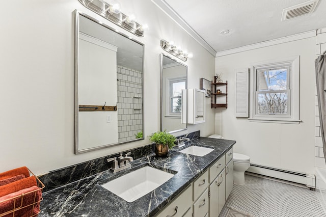 bathroom with ornamental molding, baseboard heating, a sink, and visible vents