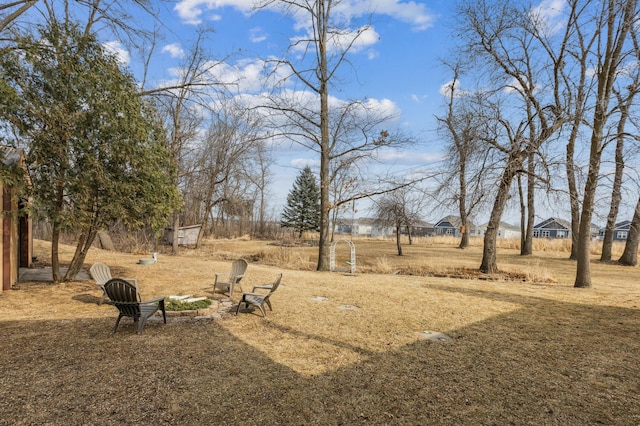 view of yard featuring a fire pit