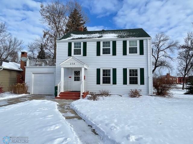 colonial home with an attached garage