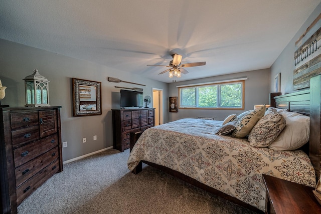 bedroom featuring carpet floors, baseboards, and a ceiling fan