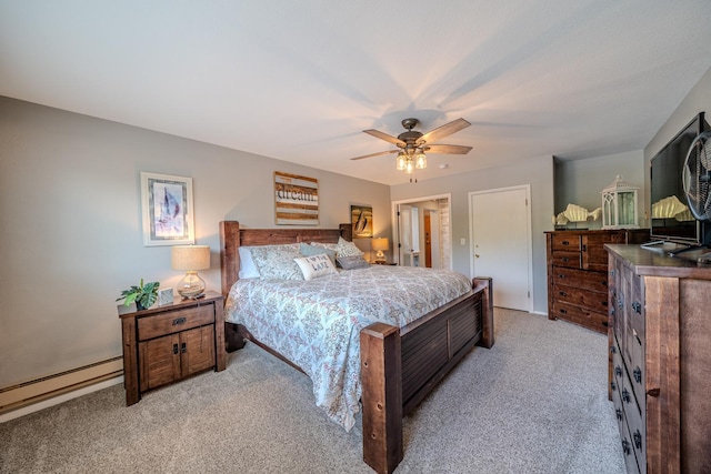 bedroom featuring ceiling fan, baseboard heating, and light colored carpet