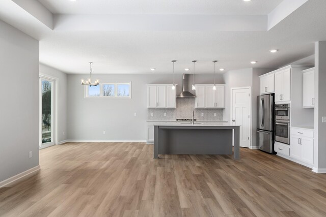10720 Harbor Ln N, Maple Grove, MN 55369 - kitchen featuring wall chimney range hood, decorative backsplash, appliances with stainless steel finishes, light wood-style floors, and recessed lighting