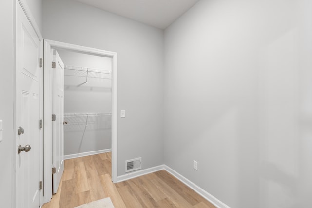 10720 Harbor Ln N, Maple Grove, MN 55369 - interior space with visible vents, a closet, baseboards, a spacious closet, and light wood finished floors