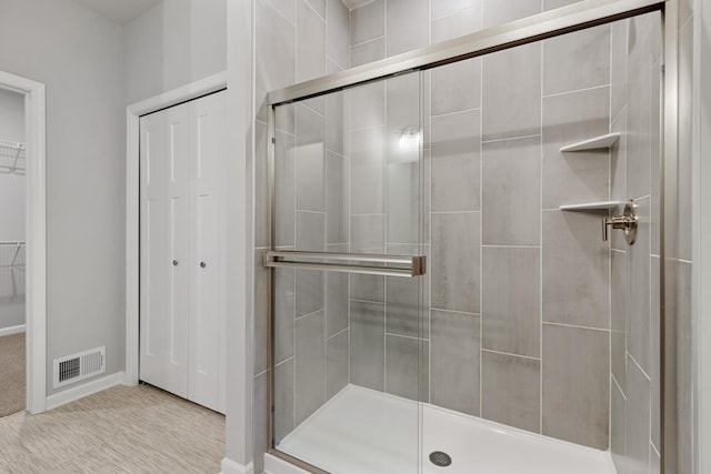 10720 Harbor Ln N, Maple Grove, MN 55369 - full bath with visible vents, baseboards, a stall shower, and a spacious closet