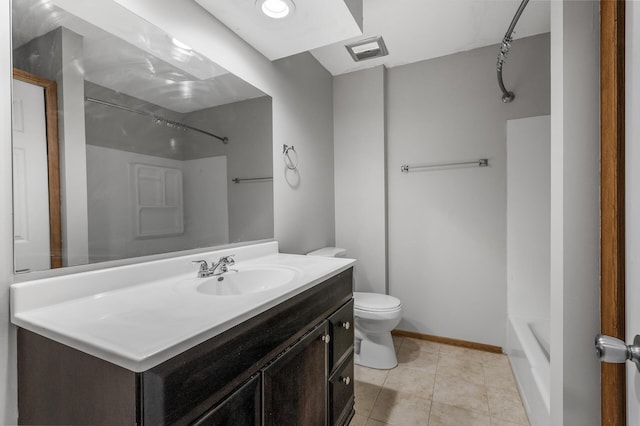 bathroom with toilet, vanity, baseboards, visible vents, and tile patterned floors