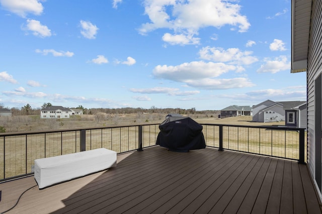 deck with a residential view and a grill