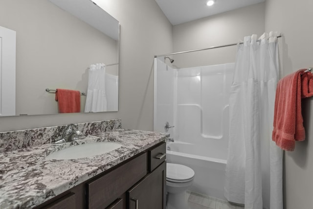 bathroom featuring toilet, vanity, and shower / tub combo with curtain