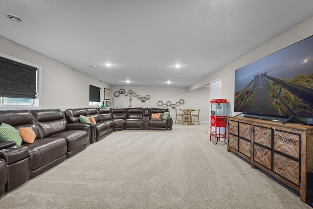 carpeted living area featuring recessed lighting