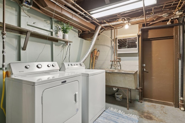 laundry room featuring washing machine and clothes dryer and laundry area