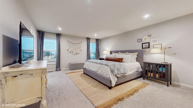 bedroom featuring recessed lighting, light carpet, and baseboards