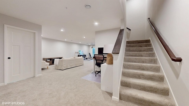 staircase with carpet, baseboards, and recessed lighting