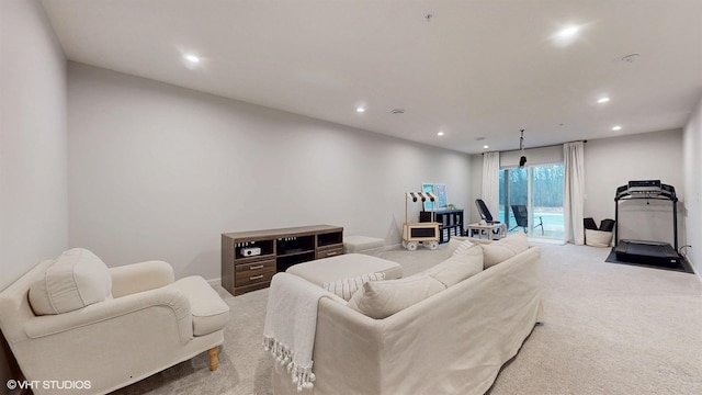 living area featuring recessed lighting and carpet flooring