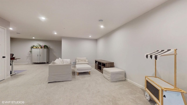 sitting room featuring baseboards, carpet flooring, and recessed lighting