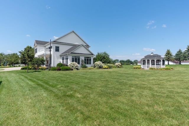 exterior space with a lawn and a gazebo