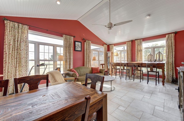 dining area featuring lofted ceiling and ceiling fan