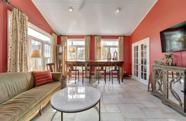 sunroom / solarium featuring wood ceiling, vaulted ceiling, a wealth of natural light, and french doors