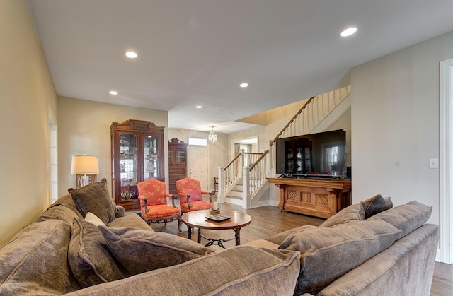 living area featuring stairway, wood finished floors, and recessed lighting