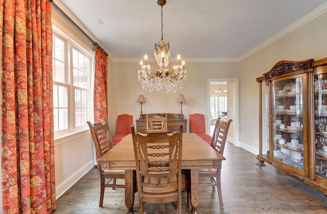 dining space with baseboards, dark wood finished floors, and crown molding