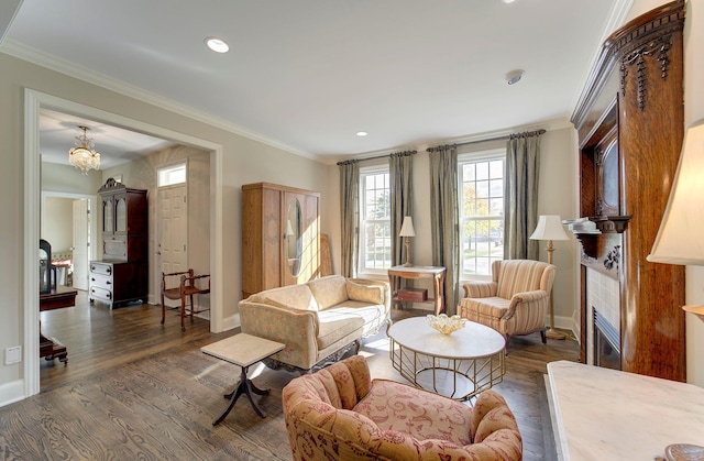 living area featuring dark wood-style floors, ornamental molding, and a tile fireplace