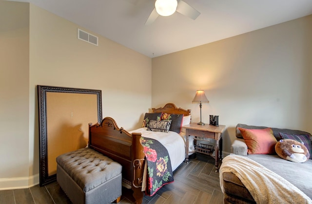 bedroom with baseboards, visible vents, and a ceiling fan