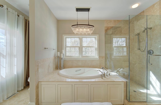 full bath featuring a garden tub and a shower stall