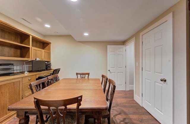 dining area featuring dark wood-type flooring, visible vents, and recessed lighting