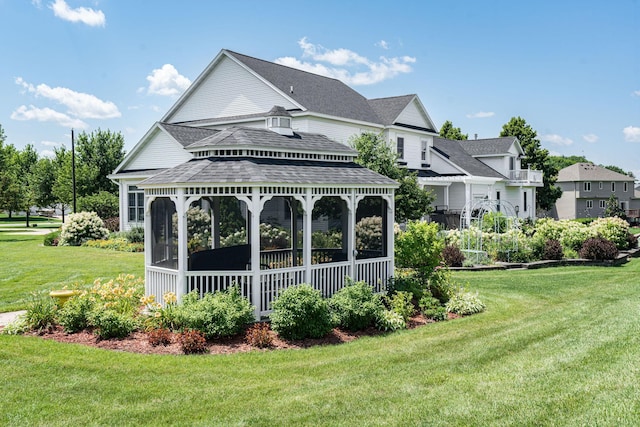 view of property's community featuring a yard and a gazebo