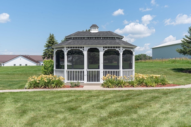 view of property's community featuring a lawn and a gazebo