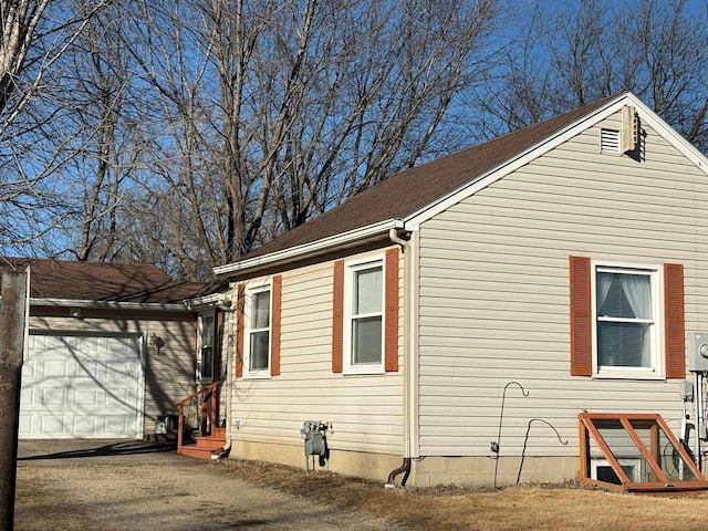 view of side of home with a garage