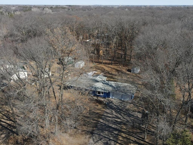 drone / aerial view featuring a forest view